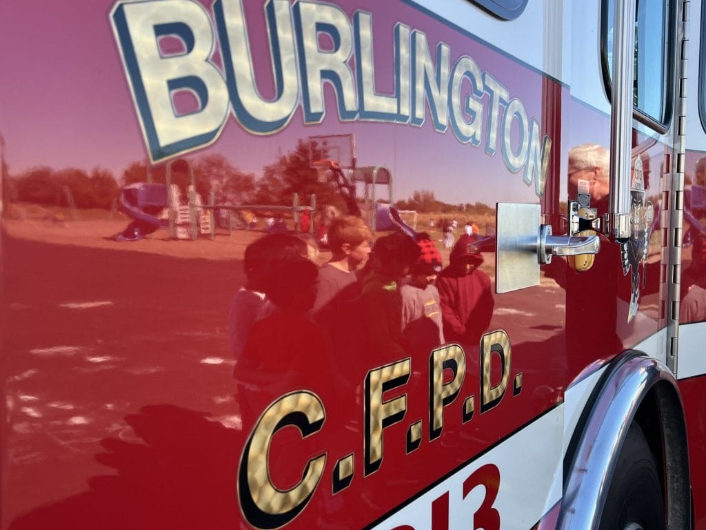 Reflection of students in fire truck