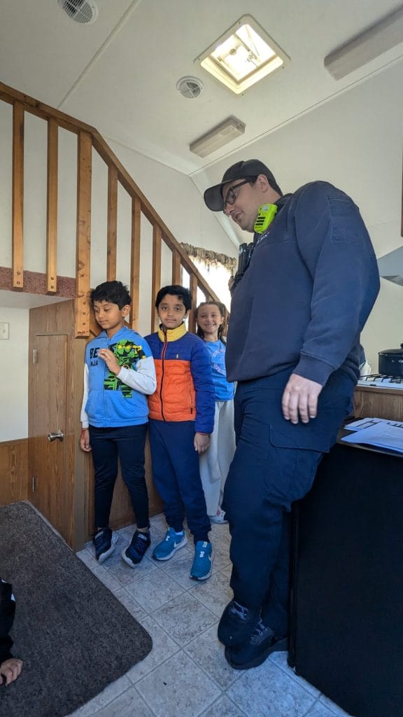 Students in a smokehouse