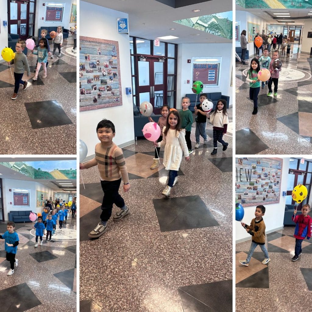 Students walking with balloon animals