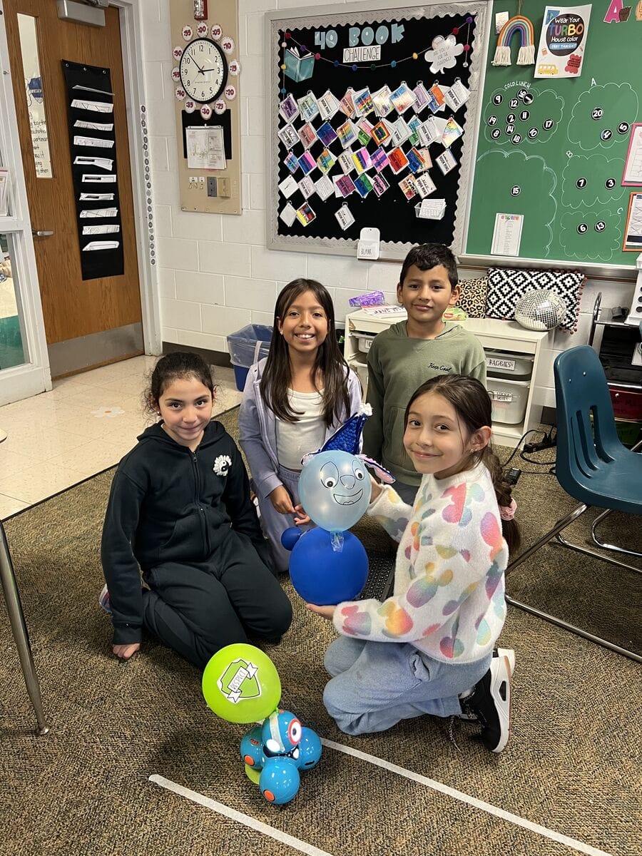 Fourth grade group showing their balloon.