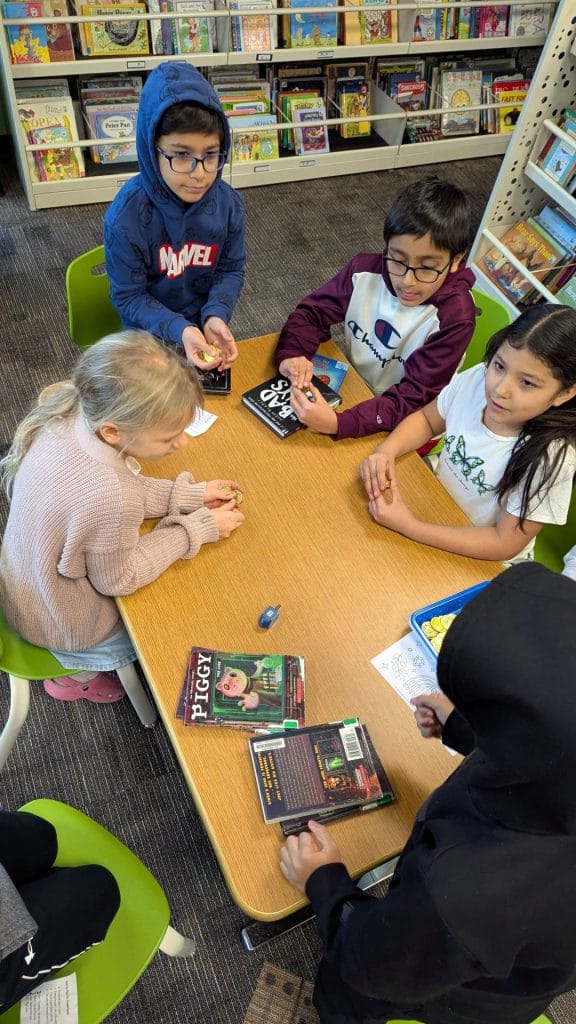 4th graders playing Dreidel