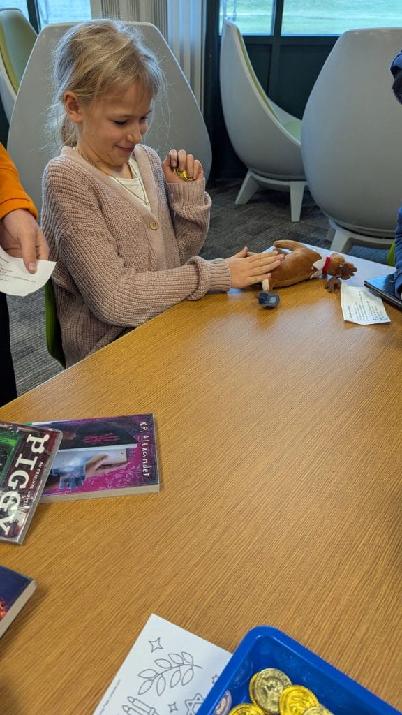 Student spinning the dreidel