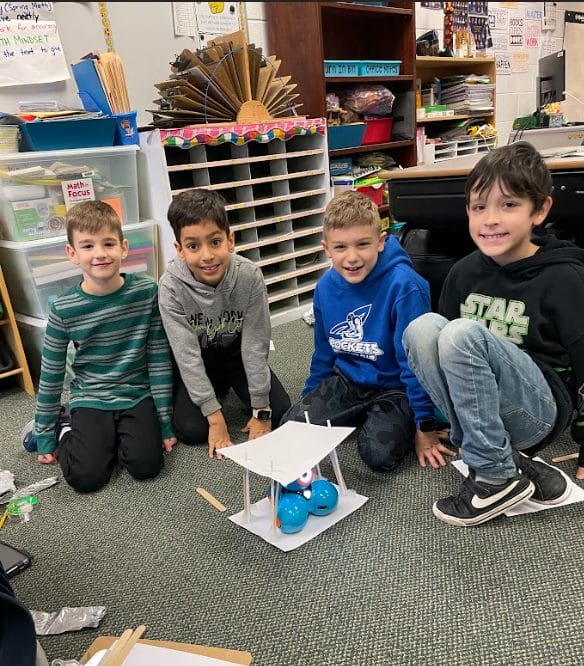 Students with their structure and robot