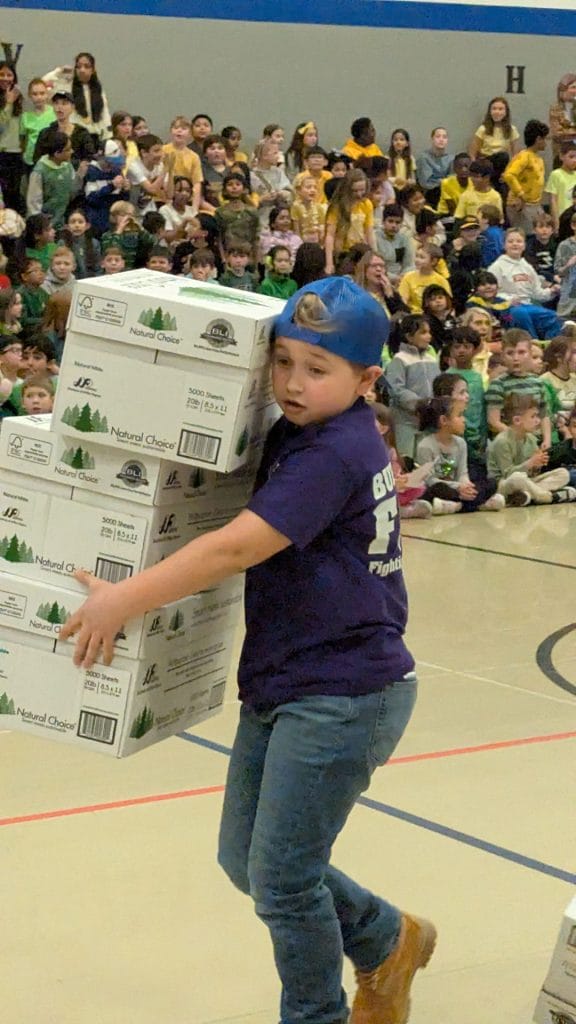 Boy holding boxes