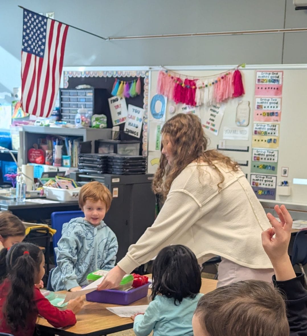 CHS student helping kinders.