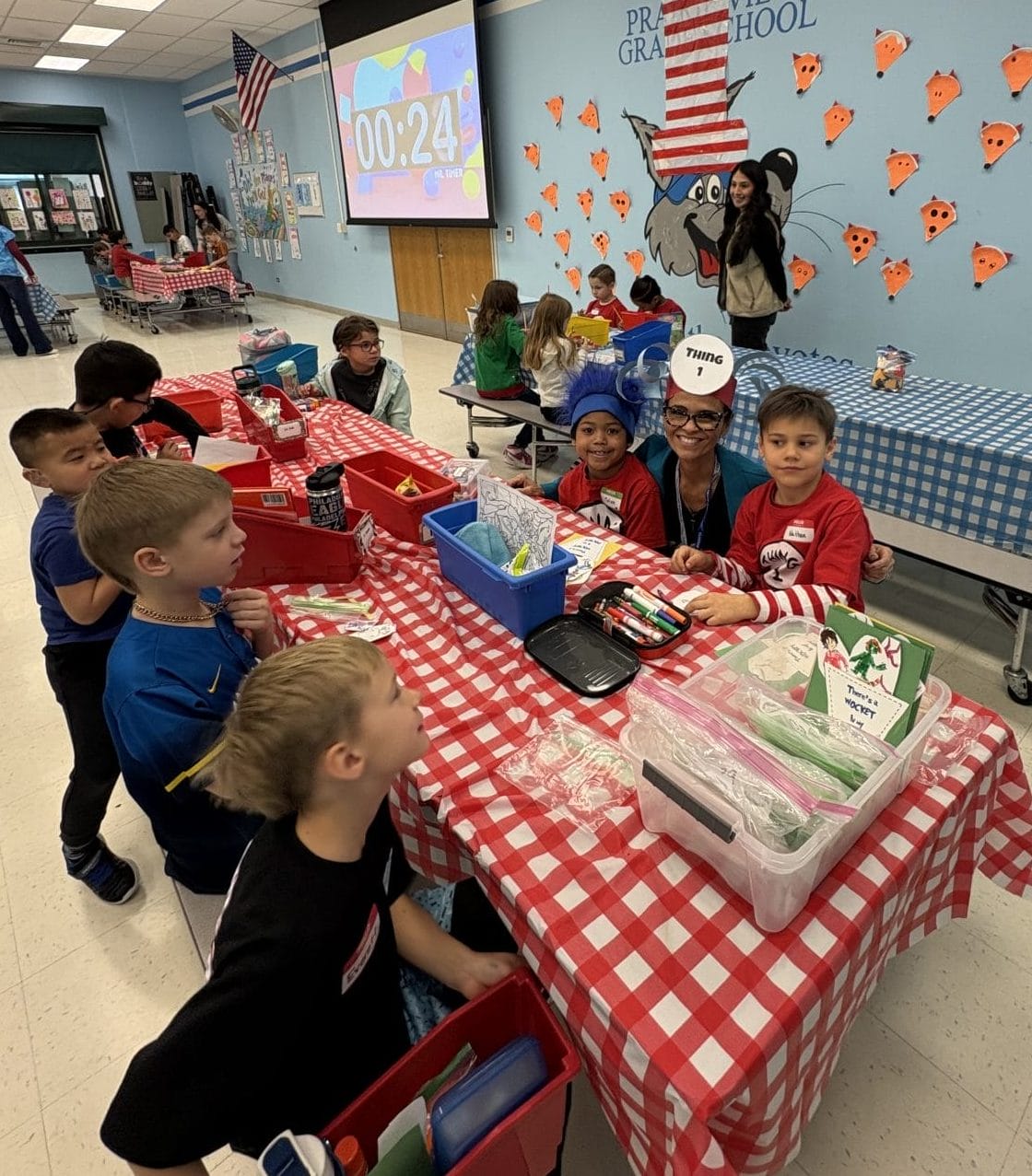 Principal Mattei enjoying Dr. Seuss day with our first graders