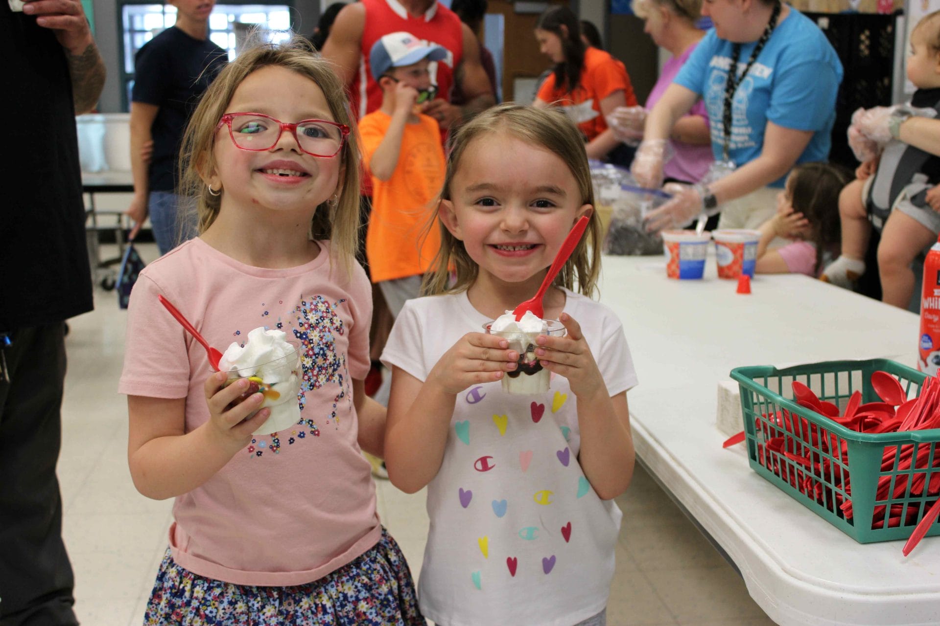 Two girls eating ice cream